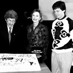 Benny Centennial 4 A specially decorated cake, provided for the occasion by Jarosch Bakery of Elk Grove Village, is admired by Chuck Schaden, Joan Benny and Bobby Blumofe. The cake was later served to the audience, the cast and special guests.
