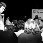 Chuck brings the microphone to a member of the studio audience.